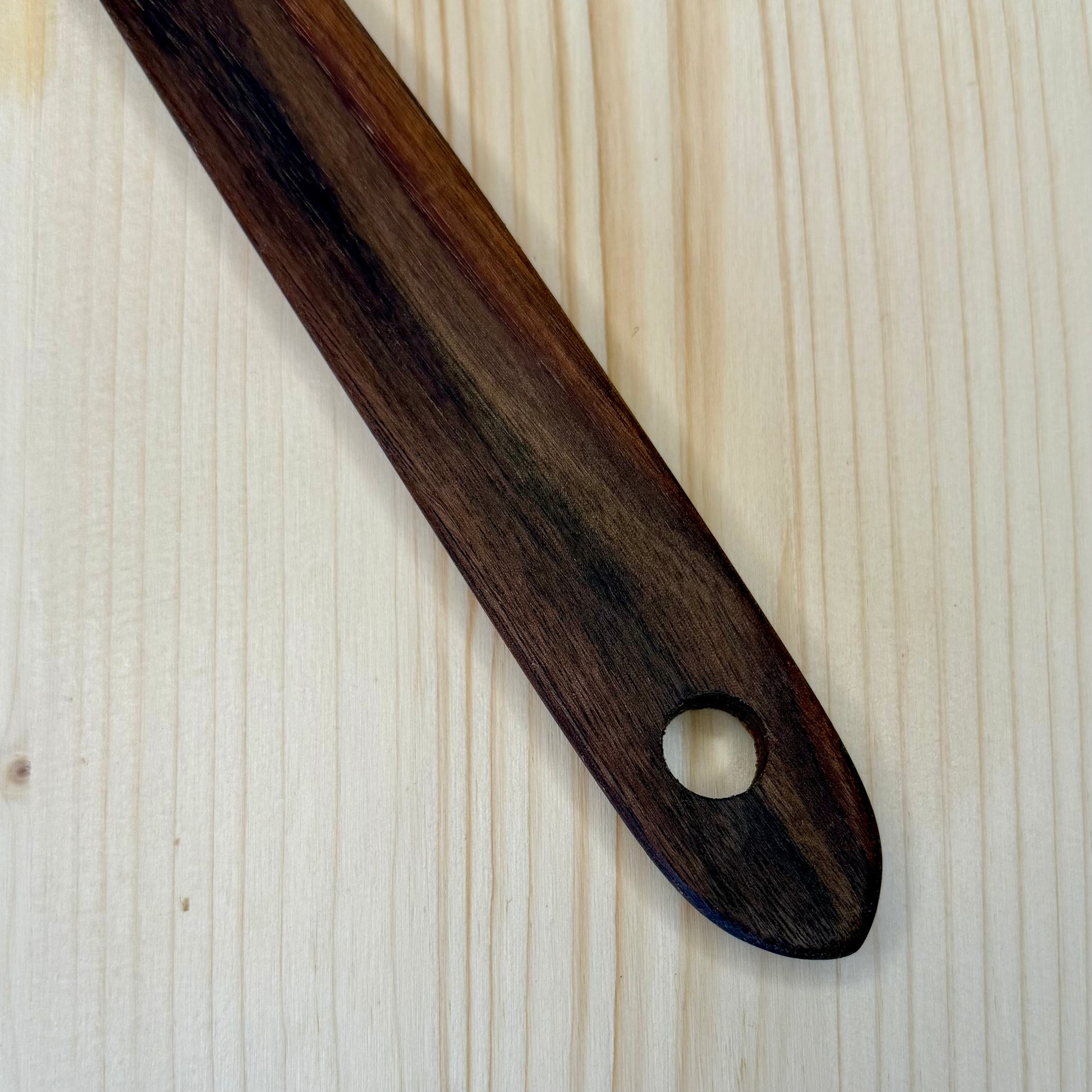 Wide bowl black walnut spoon close-up detail